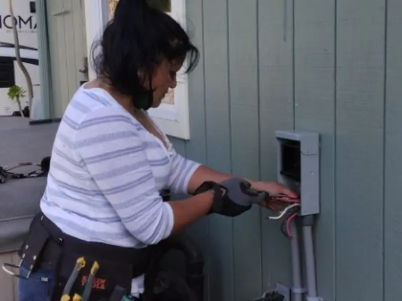 Licensed electrician wiring an exterior subpanel in Emmetsburg