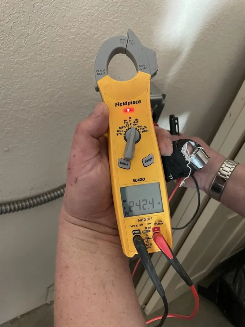 Voltage testing with clamp meter during Ceiling Fan Installation in Emmetsburg